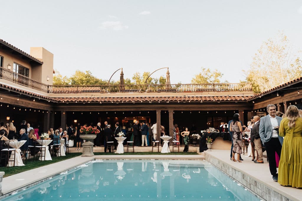 Real wedding reception poolside at golden hour